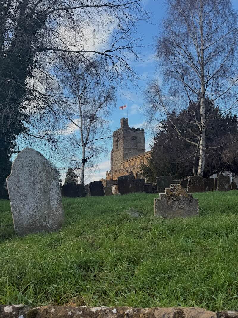 St Mary's Church tower and churchyard in Cropredy, near Banbury, Oxfordshire