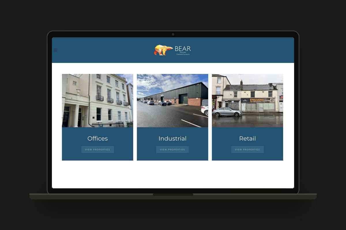 Bear Associates chartered surveyors website shown on a laptop