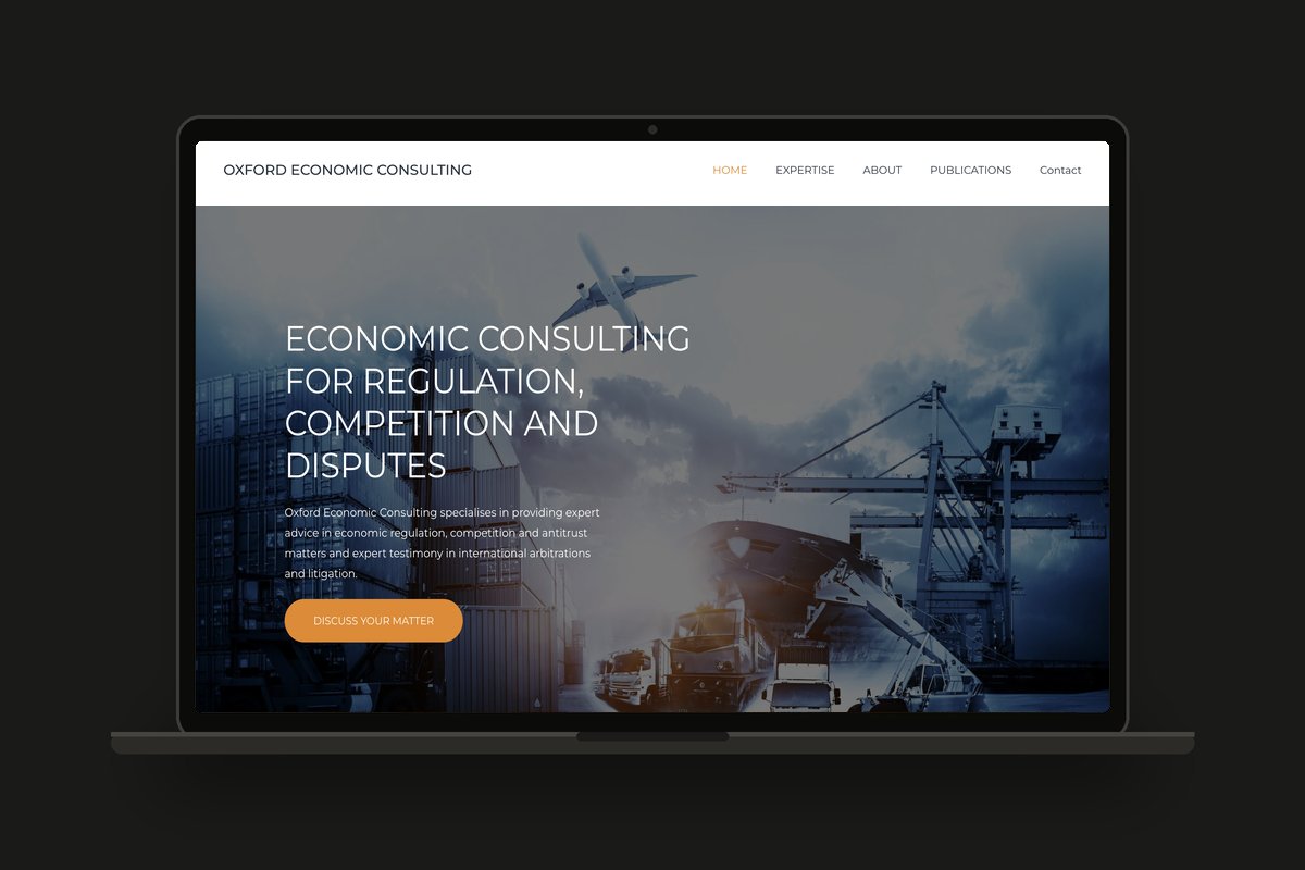 Oxford Economic Consulting website shown on a laptop