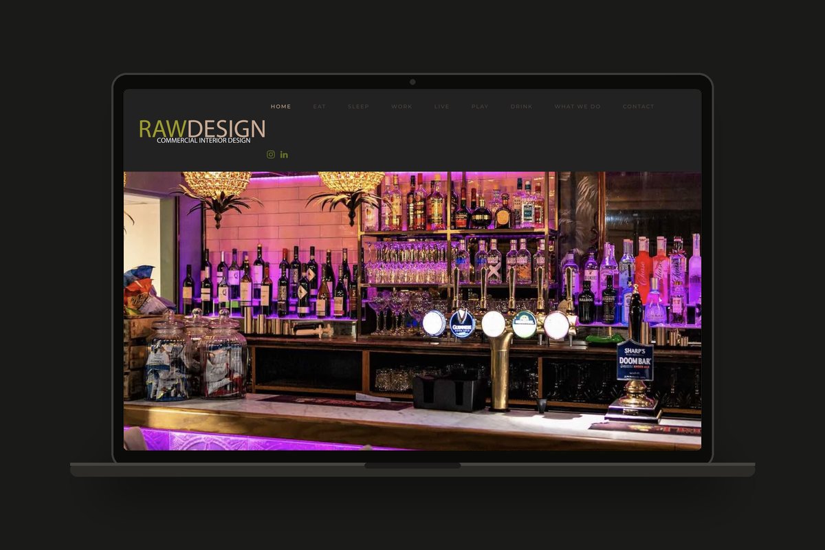RAW Design commercial interior design website shown on a laptop