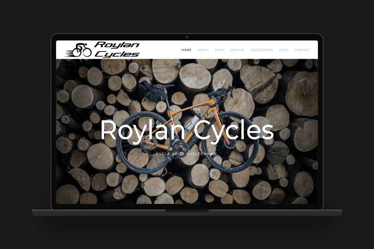 Roylan Cycles bike shop website shown on a laptop