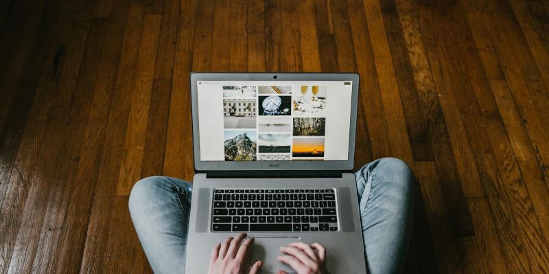 Small business owner working on a laptop, representing web design for micro-businesses and sole traders in Oxfordshire