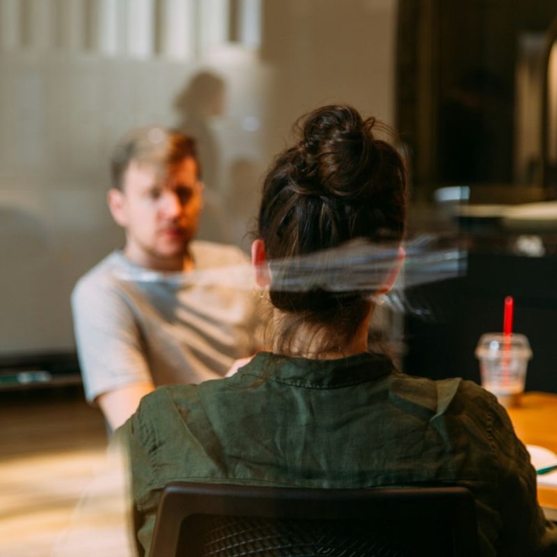 Two people discussing website improvements during a business consultation