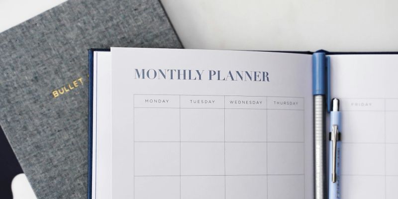 Calendar showing 2026 next to a laptop displaying a modern website refresh plan
