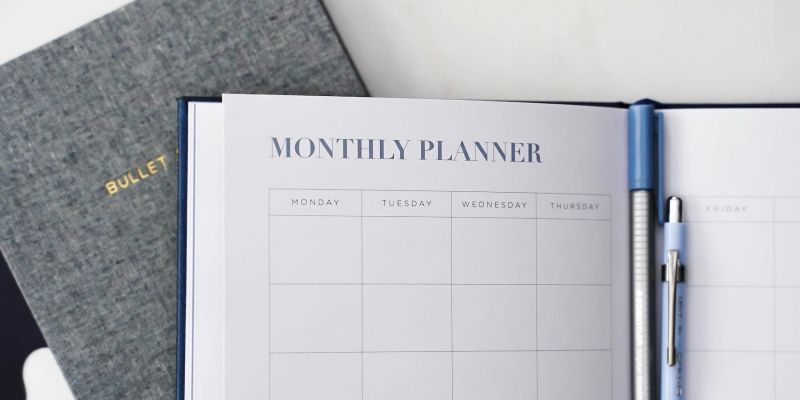 Calendar showing 2026 next to a laptop displaying a modern website refresh plan