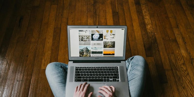 Small business owner working on a laptop, representing web design for micro-businesses and sole traders in Oxfordshire